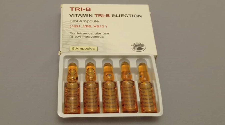 a box of vitamin tri - b injections on a blue background